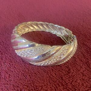 Elegant Silver Bracelet with Twisted Design and Sparkling Accents